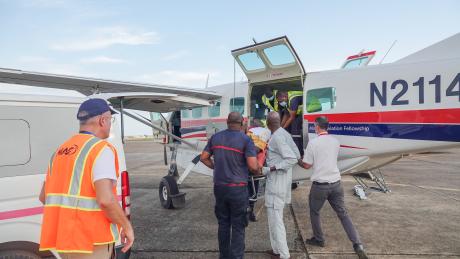 Pastor Simon arrived at Sekou Toure airport on the MAF plane